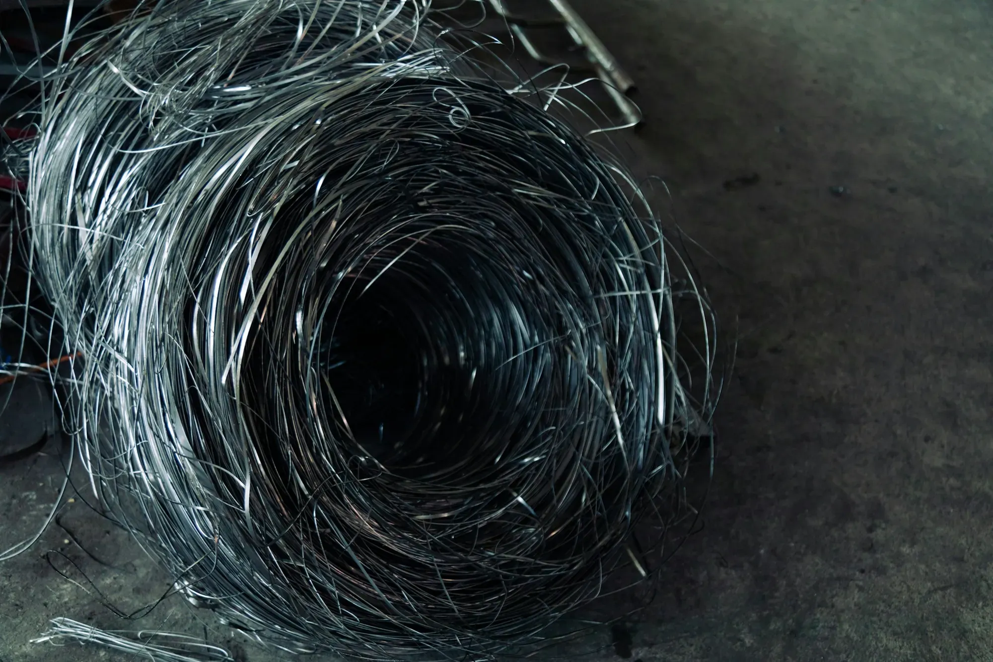 Drawn wire, coiled